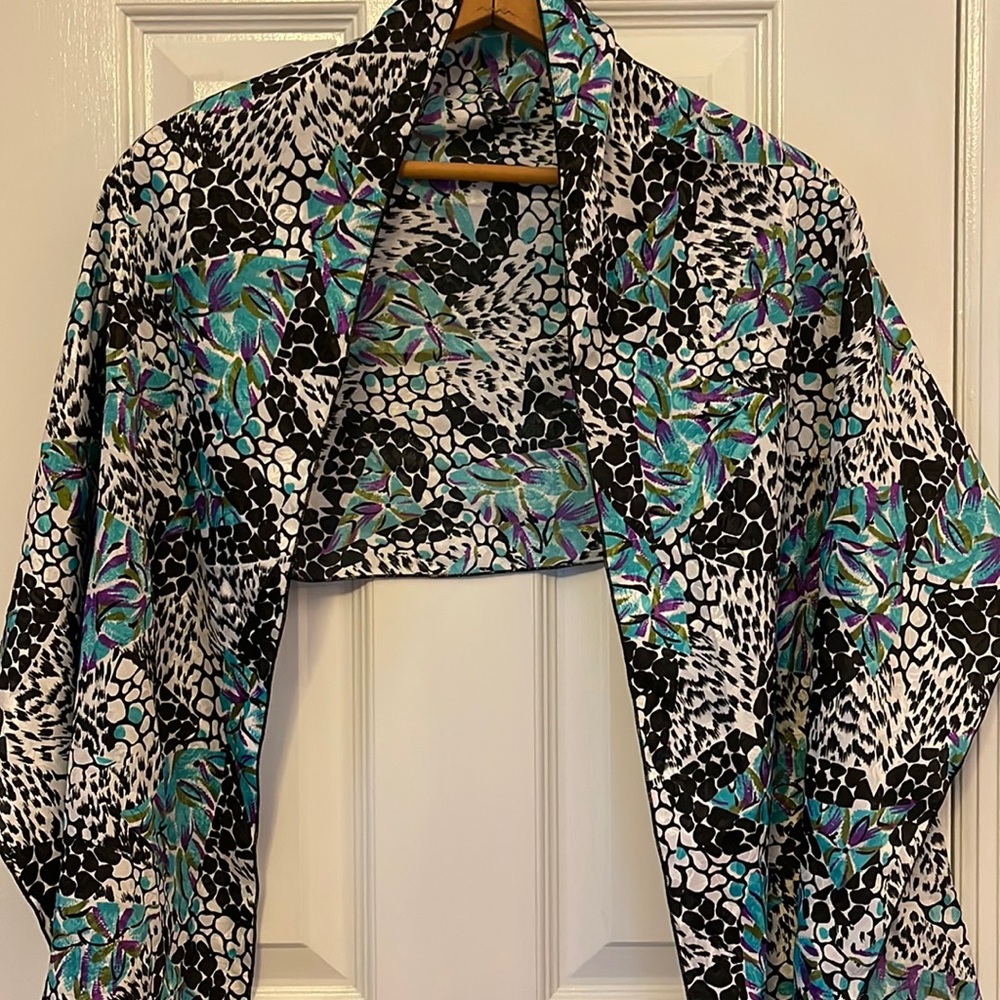Women’s lightweight wrap/scarf. Black, blue, purple and white.